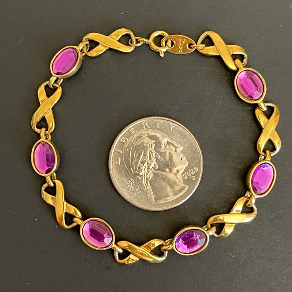 Elegant Avon purple cabochon ribbon link bracelet.